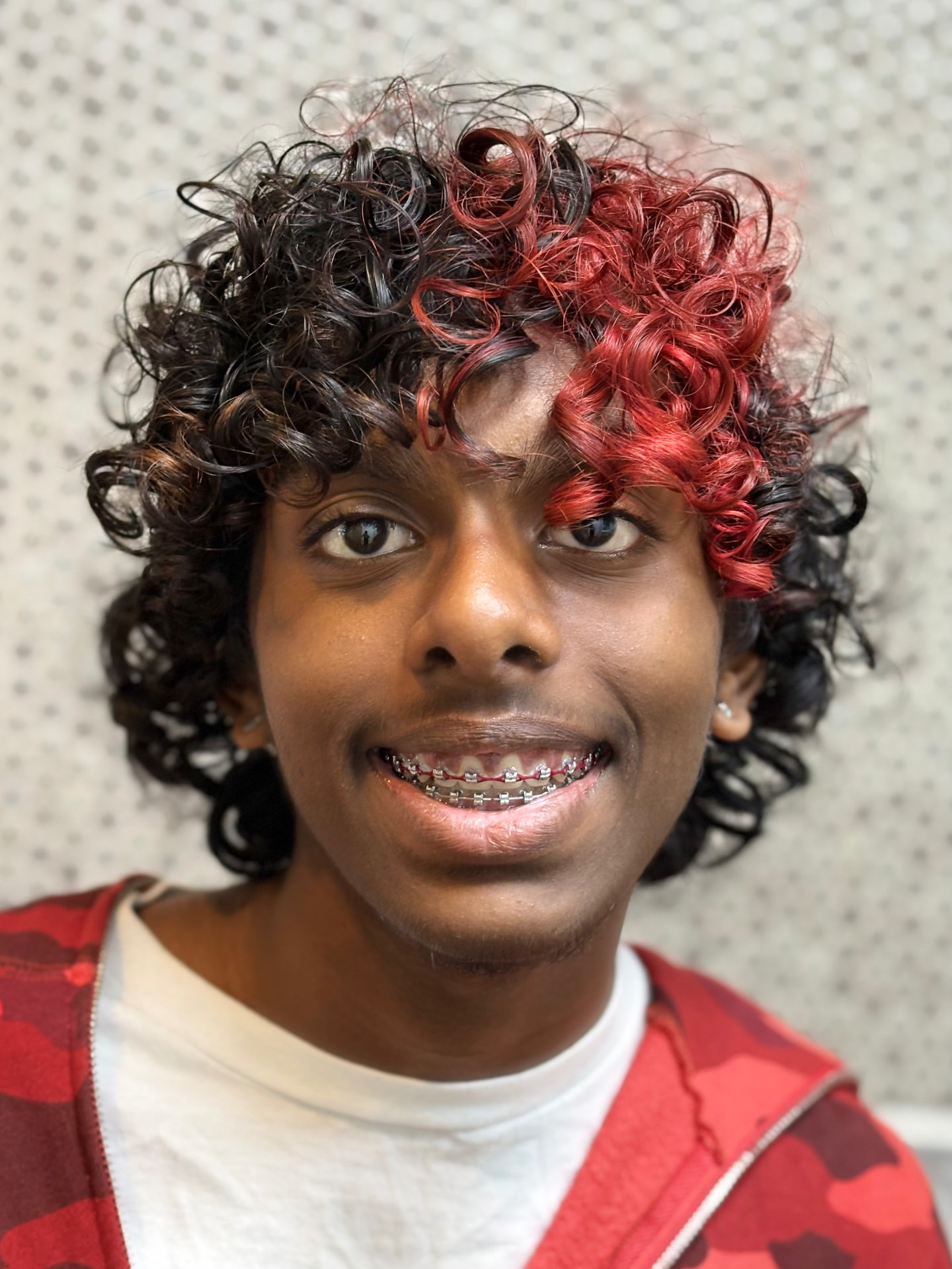 Patient smiling with braces at a New Jersey orthodontist