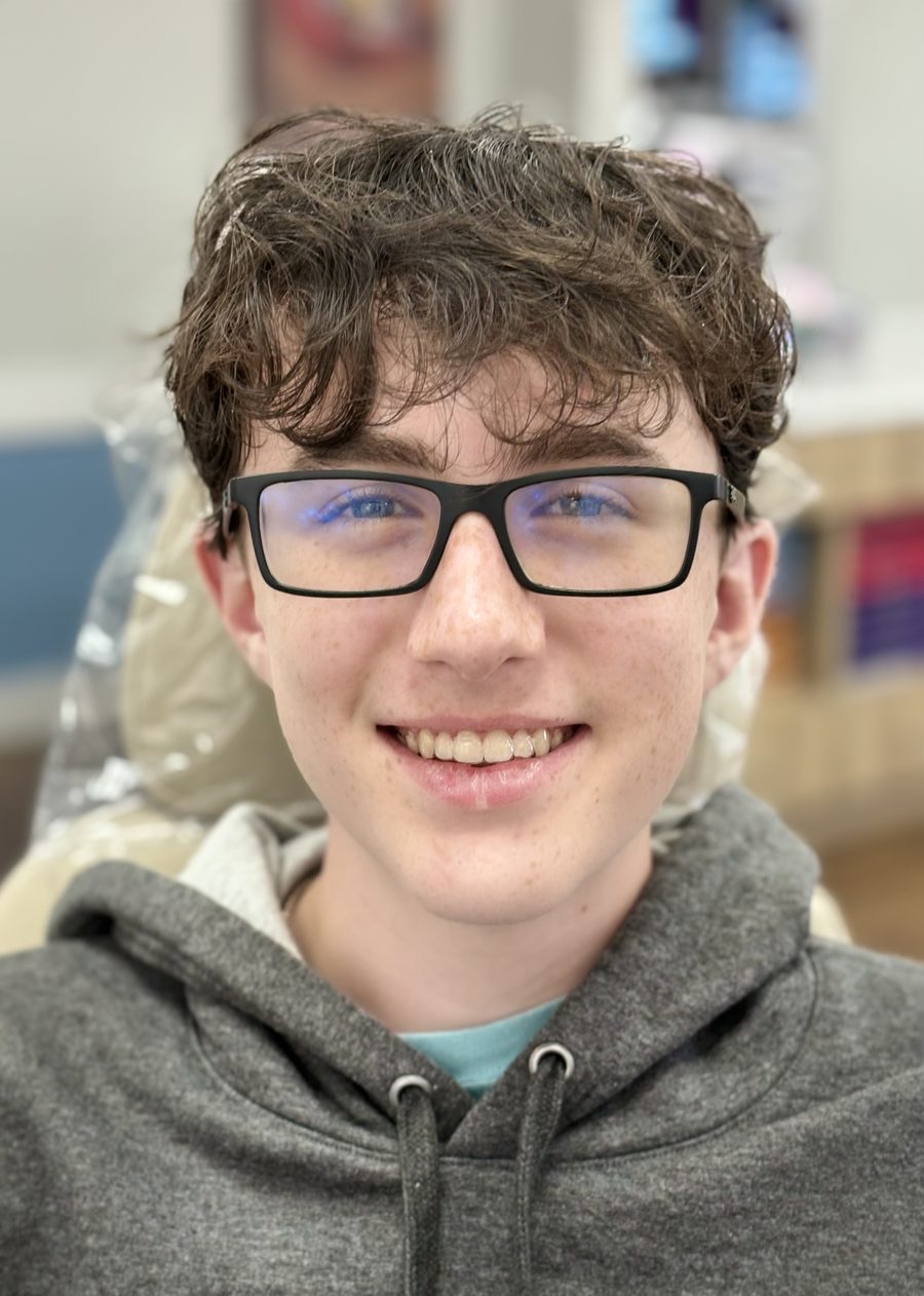 Teen patient with braces smiling